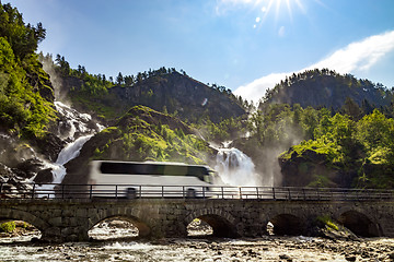Image showing Tourist bus traveling on the road Latefossen Waterfall Odda Norw