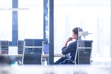 Image showing businessman working using a laptop in startup office