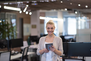 Image showing Business Woman Using Digital Tablet in front of startup Office