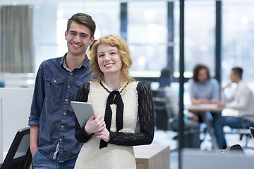 Image showing Business People Working With Tablet in startup office