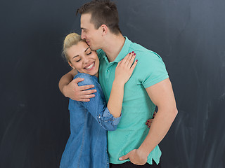 Image showing couple in front of gray chalkboard