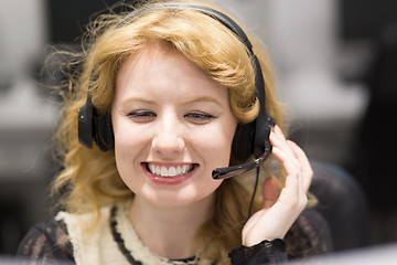 Image showing female call centre operator doing her job