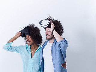 Image showing multiethnic couple getting experience using VR headset glasses