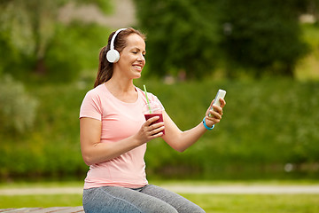 Image showing woman with smartphone and shake listening to music