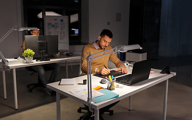 Image showing man or designer with computer and tablet at office