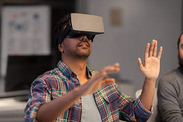 Image showing creative man in virtual reality headset at office