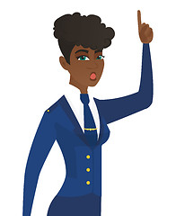 Image showing Stewardess with open mouth pointing finger up.