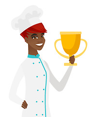 Image showing Young african-american chef holding a trophy.