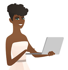Image showing Young african-american bride using a laptop.