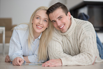 Image showing Young Couple using digital tablet on cold winter day