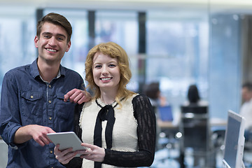 Image showing Business People Working With Tablet in startup office