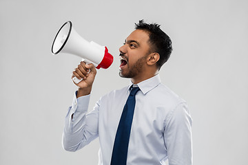 Image showing indian businessman screaming over grey