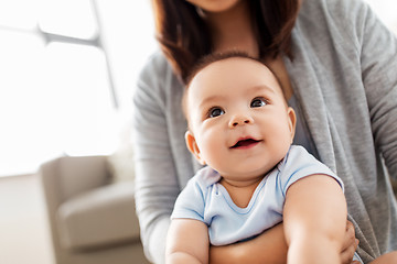 Image showing close up of asian baby boy with mother