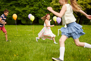 Image showing happy kids playing tag game at birthday party