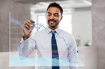 Image showing businessman with marker drawing chart at office