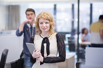 Image showing Business People Working With Tablet in startup office