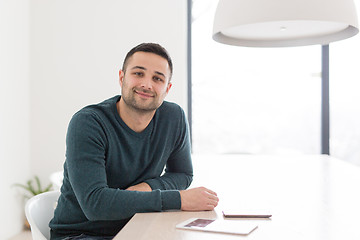 Image showing Young casual businessman using smartphone