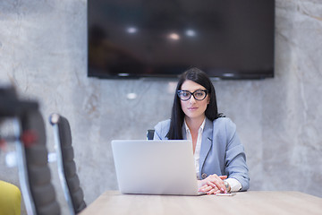 Image showing businesswoman using a laptop in startup office