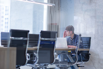 Image showing businessman working using a laptop in startup office