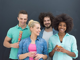 Image showing confetti party multiethnic group of people isolated over gray