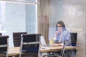 Image showing businesswoman using a laptop in startup office