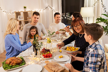 Image showing happy family having dinner party at home