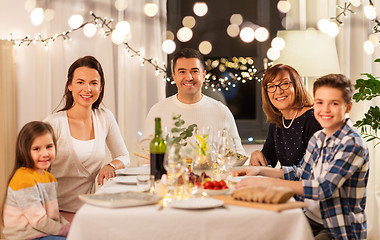 Image showing happy family having dinner party at home