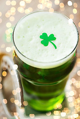 Image showing close up of glass of green beer with shamrock