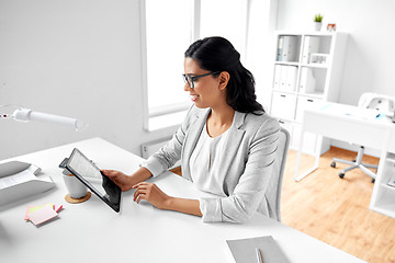 Image showing businesswoman with tablet computer at office