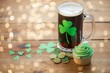 Image showing shamrock on glass of beer, green cupcake and coins