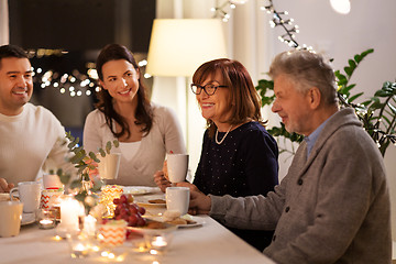 Image showing happy family having tea party at home