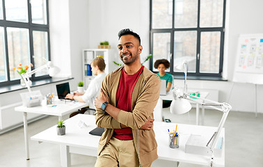 Image showing smiling indian man with smart watch at office