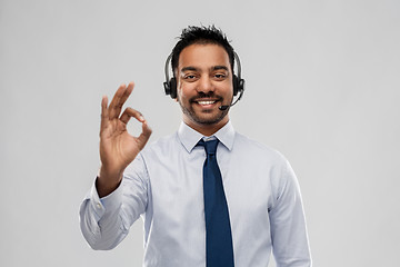 Image showing businessman or helpline operator showing ok sign