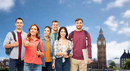 Image showing group of students showing thumbs up over london