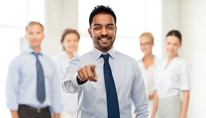 Image showing businessman pointing to you over business team