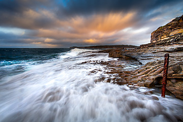 Image showing Waves washing up along the rocks of Bare Island