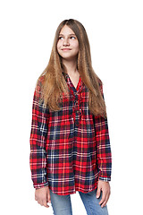 Image showing Teen girl in checkered shirt standing casually