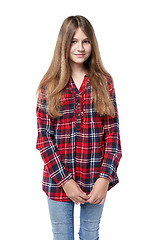 Image showing Teen girl in checkered shirt standing casually