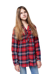 Image showing Teen girl in checkered shirt standing casually