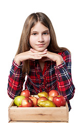 Image showing Teen girl with apples and pears in a box