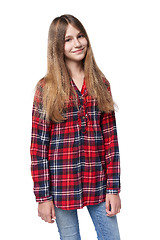 Image showing Teen girl in checkered shirt standing casually
