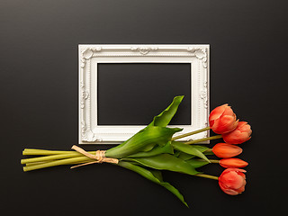Image showing white frame on black background with tulip flowers
