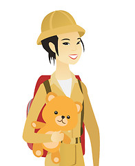 Image showing Young asian woman traveling with teddy bear.