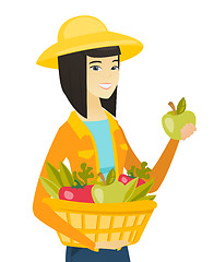 Image showing Farmer harvesting harvest of vegetables and fruits
