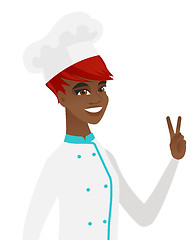 Image showing African-american chef cook showing victory gesture