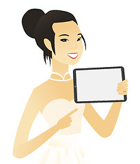 Image showing Young asian fiancee holding tablet computer.