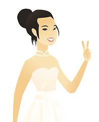 Image showing Young asian fiancee showing the victory gesture.