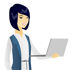 Image showing Young asian business woman using a laptop.
