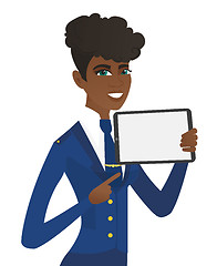 Image showing Young african stewardess holding tablet computer.