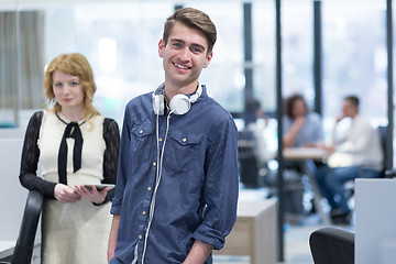 Image showing Business People Working With Tablet in startup office